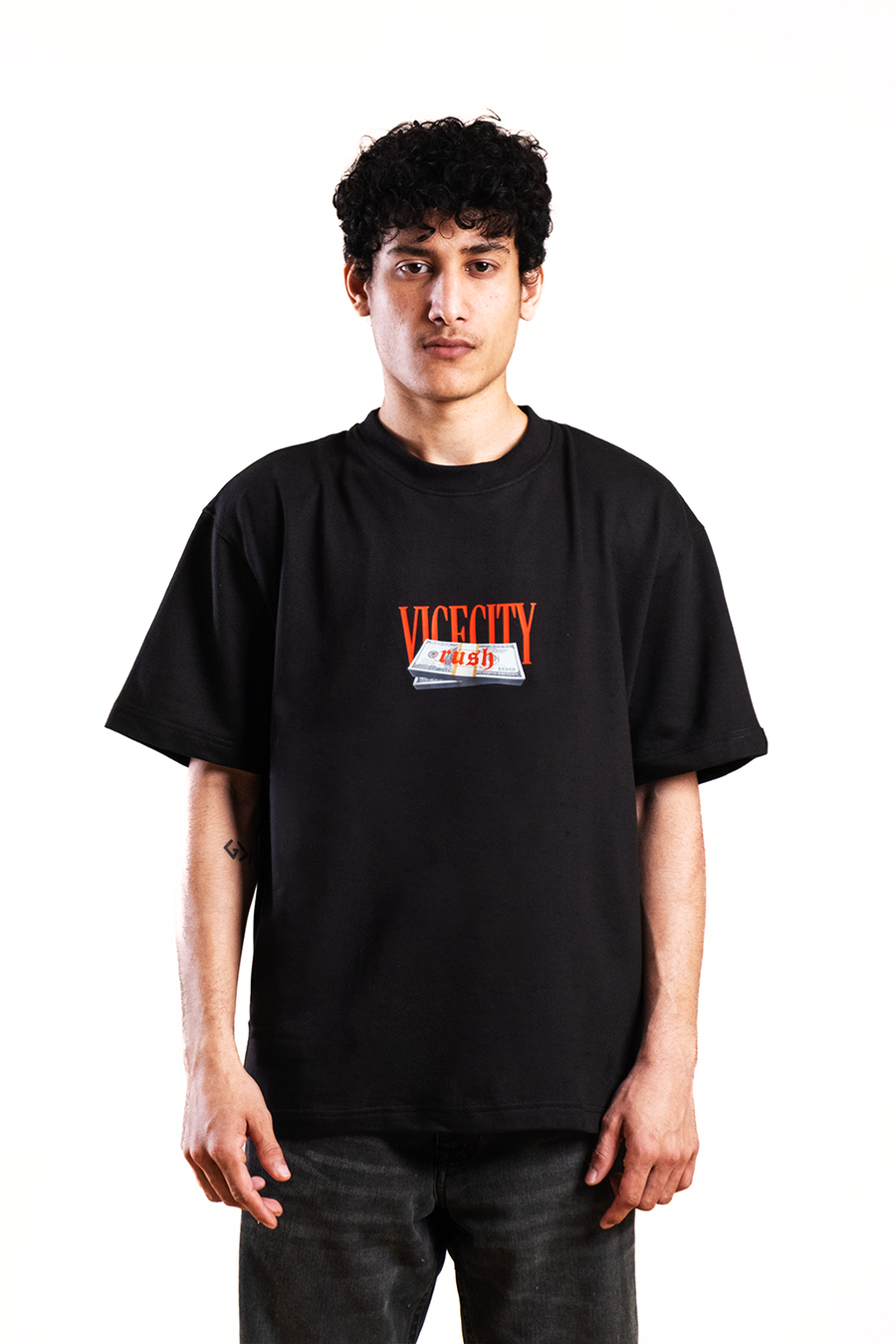 Person wearing a black t-shirt with a logo on a white background